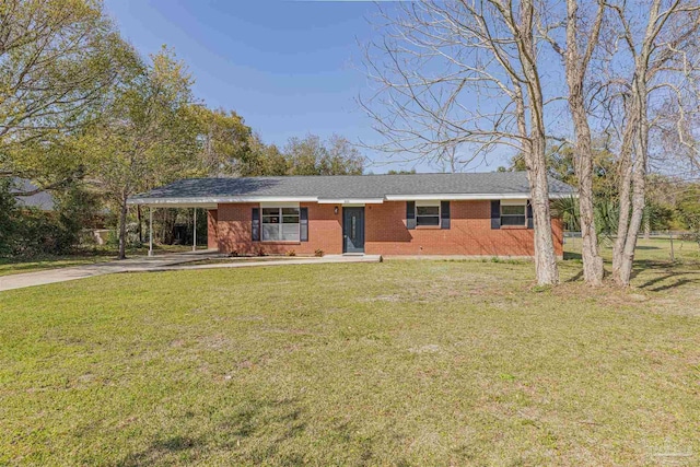 ranch-style house featuring brick siding, a carport, concrete driveway, and a front lawn