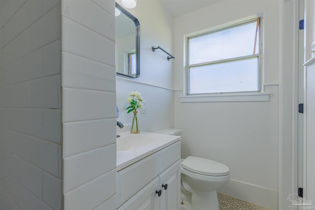 bathroom with vanity and toilet