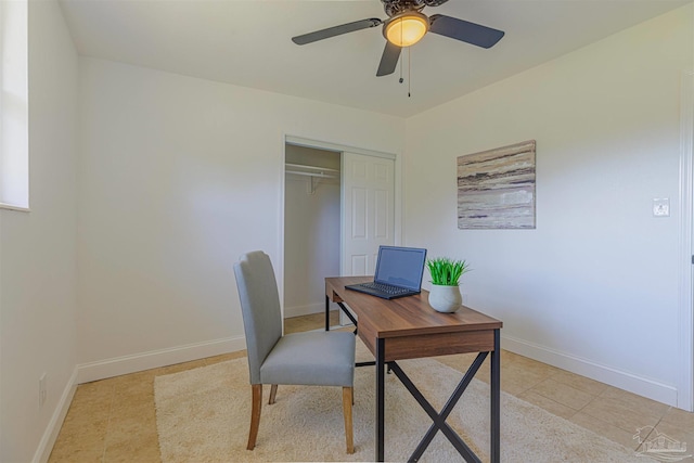 office with light tile patterned floors, baseboards, and a ceiling fan