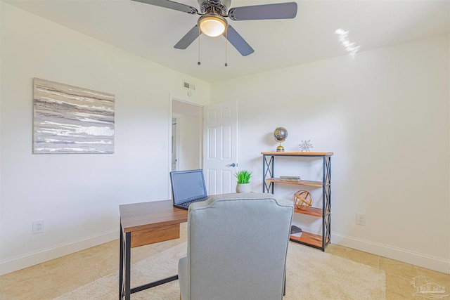 office area featuring light tile patterned floors, baseboards, and a ceiling fan