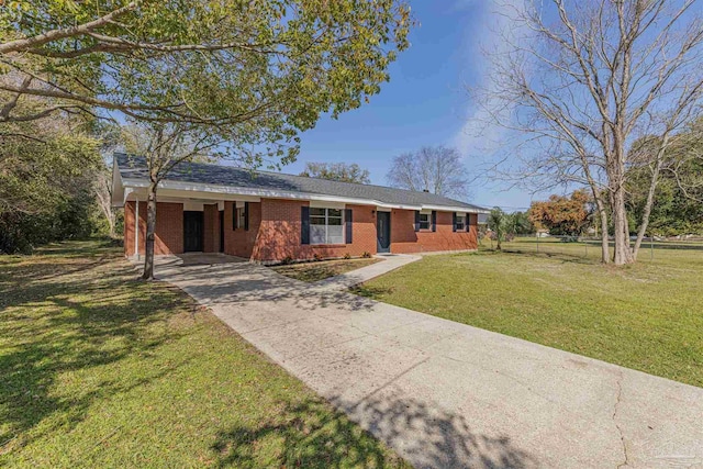 single story home with brick siding, a front lawn, a carport, and driveway