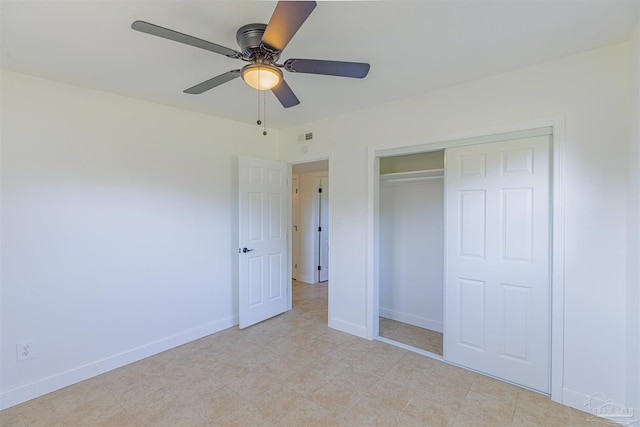 unfurnished bedroom with a closet, baseboards, visible vents, and a ceiling fan