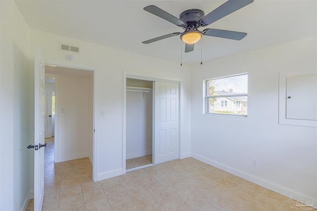 unfurnished bedroom featuring a ceiling fan, baseboards, visible vents, and a closet