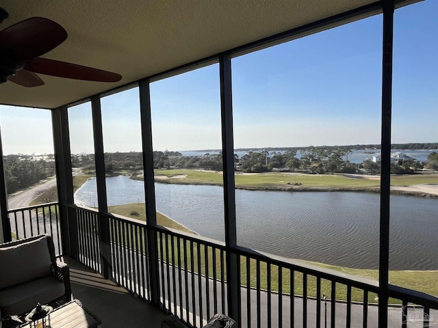 unfurnished sunroom featuring a water view