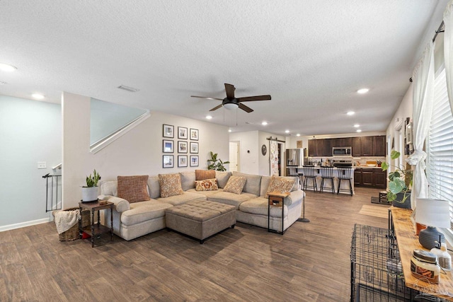 4678 Perception Cir, Milton, FL 32570 - living room with dark wood-style floors, ceiling fan, recessed lighting, a textured ceiling, and baseboards