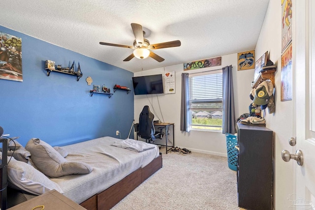 4678 Perception Cir, Milton, FL 32570 - bedroom with carpet, a textured ceiling, a ceiling fan, and baseboards