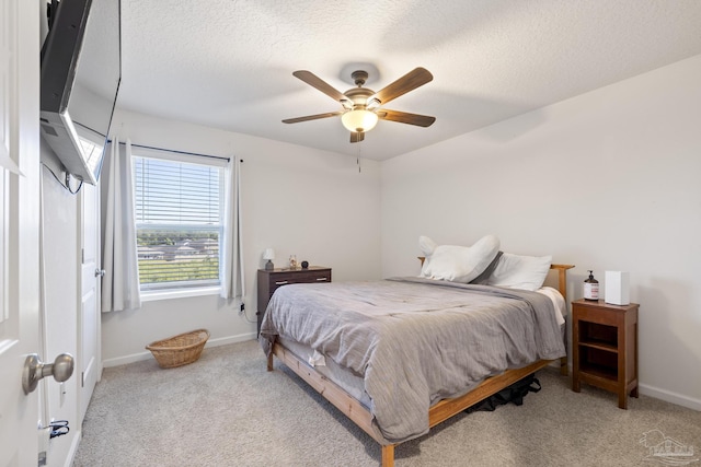 4678 Perception Cir, Milton, FL 32570 - bedroom featuring carpet, baseboards, a textured ceiling, and a ceiling fan