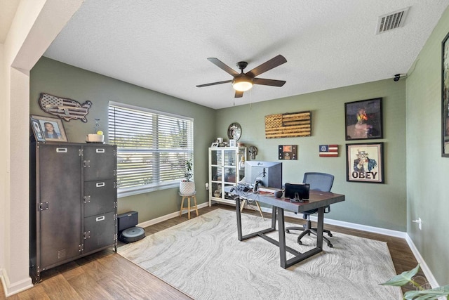 4678 Perception Cir, Milton, FL 32570 - office space featuring wood finished floors, a ceiling fan, baseboards, and a textured ceiling
