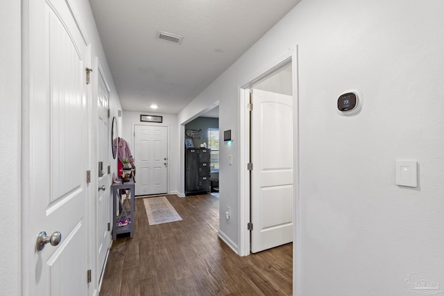 4678 Perception Cir, Milton, FL 32570 - corridor featuring dark wood-style flooring and baseboards
