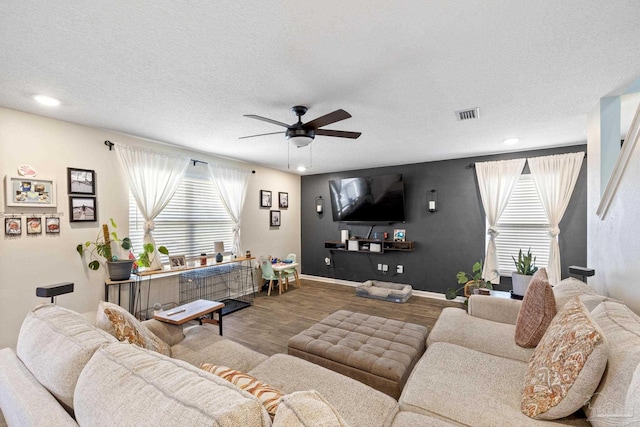 4678 Perception Cir, Milton, FL 32570 - living room with a ceiling fan, wood finished floors, baseboards, recessed lighting, and a textured ceiling