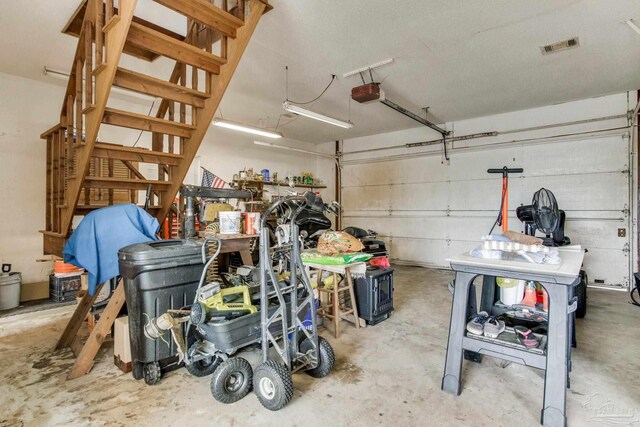 garage featuring visible vents and a garage door opener