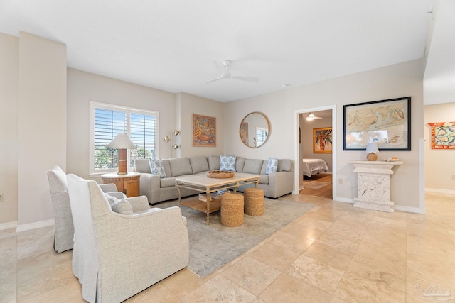 living room with ceiling fan and light tile patterned floors