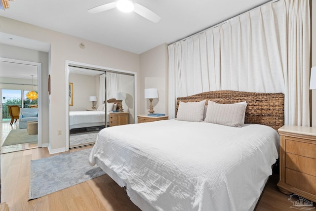 bedroom featuring ceiling fan, a closet, and wood-type flooring