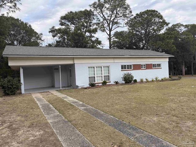 ranch-style house with a front lawn and a carport