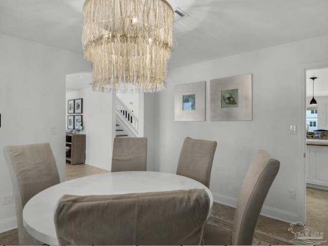 dining space featuring an inviting chandelier