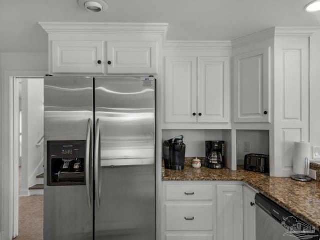 kitchen featuring white cabinetry, dark stone countertops, and appliances with stainless steel finishes