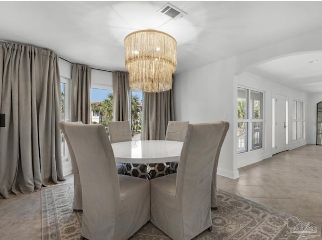 dining room with a notable chandelier