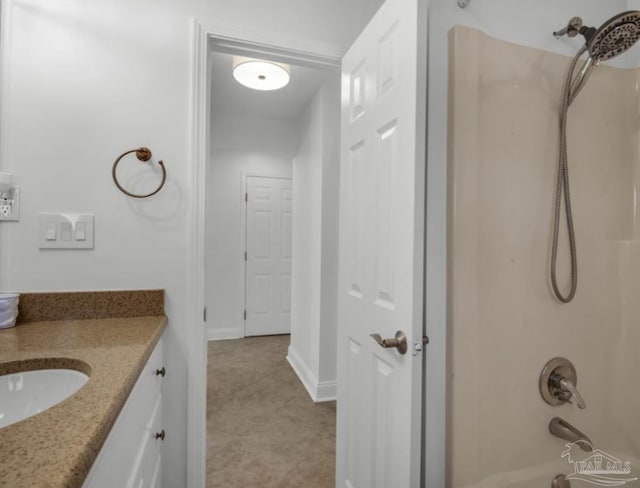 bathroom with shower / tub combination and vanity