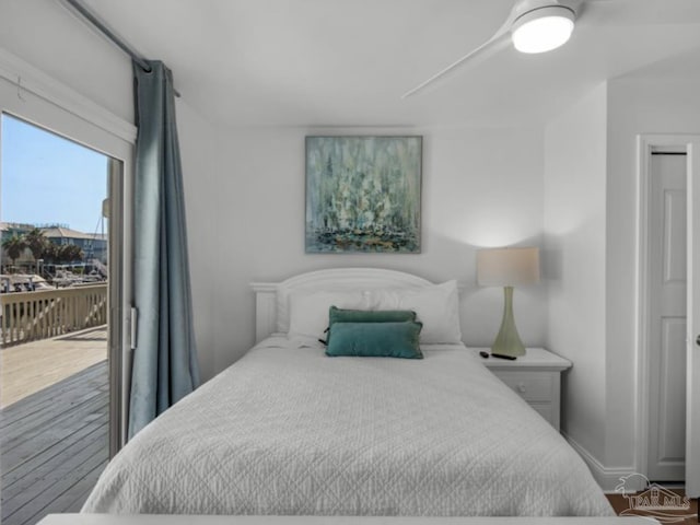 bedroom featuring hardwood / wood-style flooring and access to outside