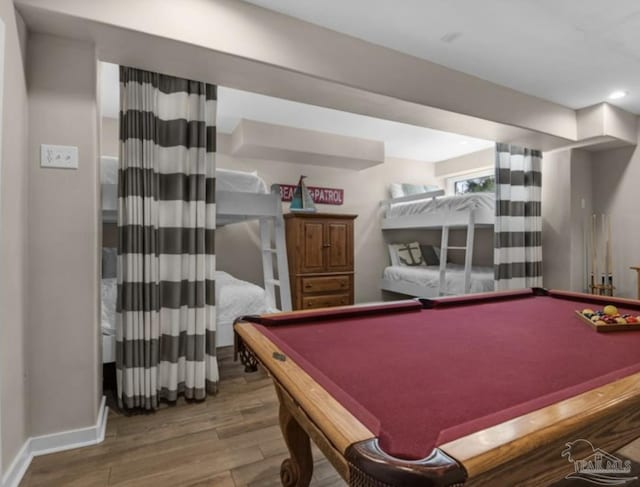 recreation room with hardwood / wood-style flooring and pool table