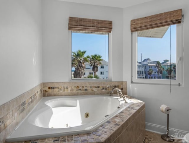 bathroom with tiled tub