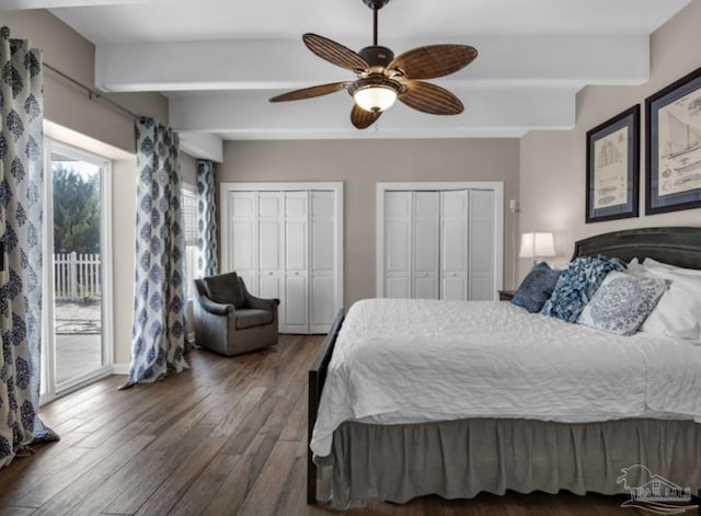 bedroom featuring dark hardwood / wood-style floors, beamed ceiling, access to exterior, ceiling fan, and multiple closets