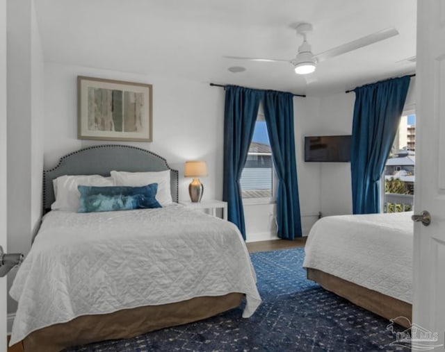 bedroom featuring dark hardwood / wood-style floors and ceiling fan