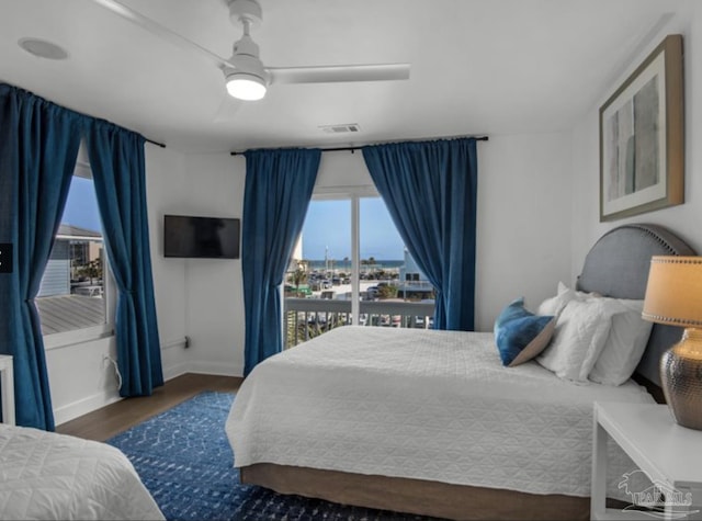 bedroom featuring ceiling fan and dark hardwood / wood-style flooring