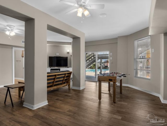 dining room featuring ceiling fan and dark hardwood / wood-style flooring