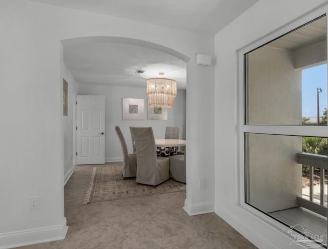 dining area featuring an inviting chandelier