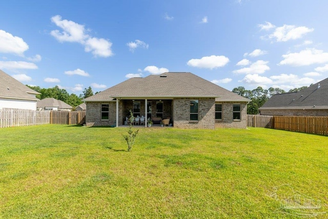 2929 Trestle Way, Cantonment, FL 32533 - rear view of house featuring a lawn, a fenced backyard, and a patio area