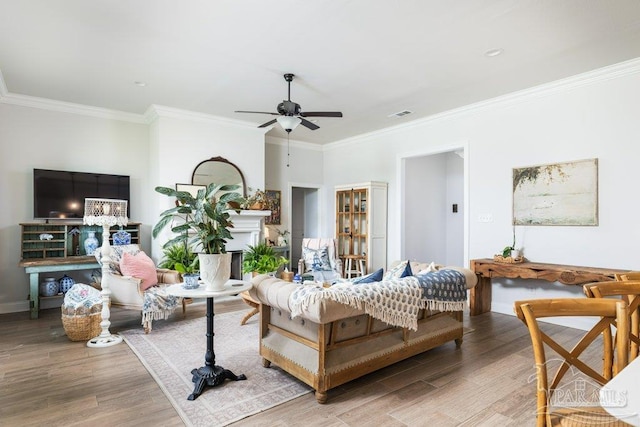 2929 Trestle Way, Cantonment, FL 32533 - bedroom with light wood-style floors, ornamental molding, a fireplace, and visible vents