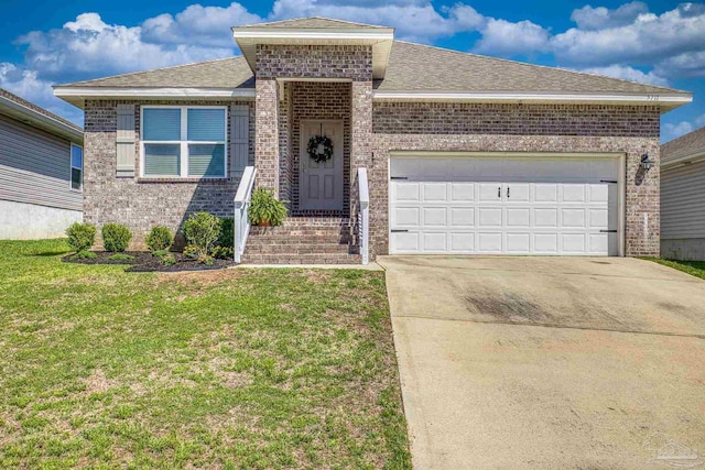 5711 Guinevere Ln, Milton, FL 32583 - view of front of home with an attached garage, concrete driveway, a front yard, and brick siding