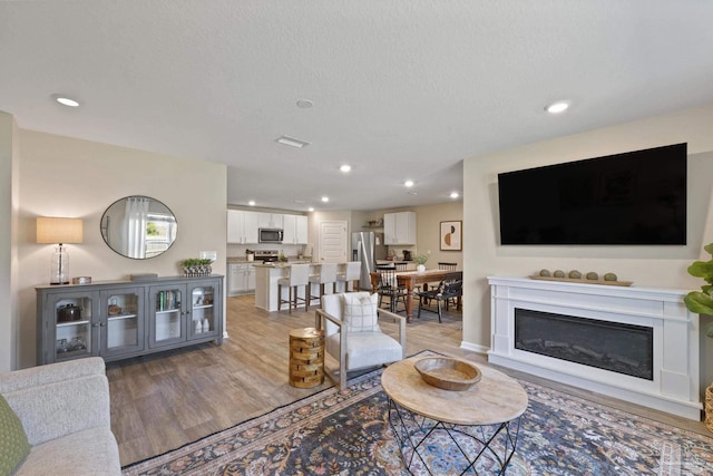 5711 Guinevere Ln, Milton, FL 32583 - living room with recessed lighting, visible vents, and light wood-type flooring