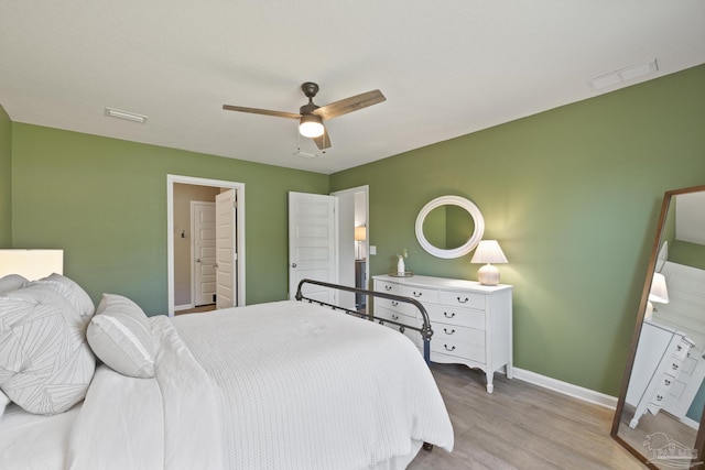 5711 Guinevere Ln, Milton, FL 32583 - bedroom with light wood finished floors, baseboards, a ceiling fan, and visible vents