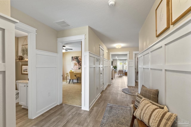 5711 Guinevere Ln, Milton, FL 32583 - hallway with visible vents and light wood-type flooring