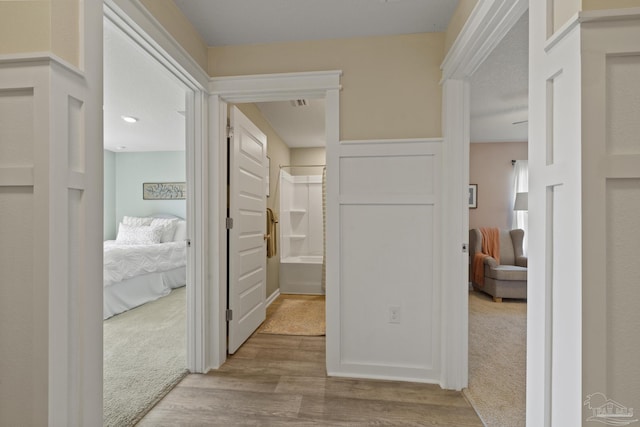 5711 Guinevere Ln, Milton, FL 32583 - hallway with wood finished floors and carpet floors