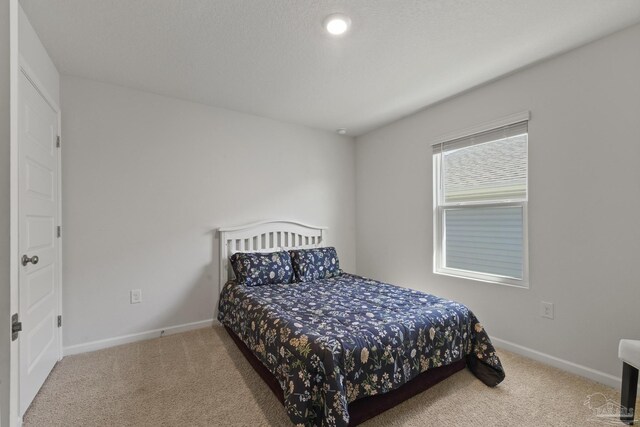 5711 Guinevere Ln, Milton, FL 32583 - bedroom featuring baseboards and carpet floors