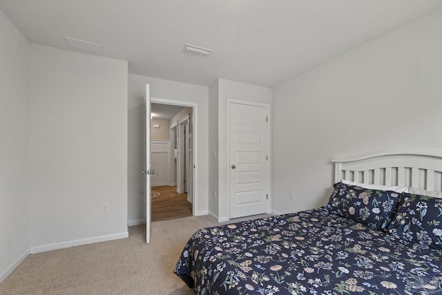 5711 Guinevere Ln, Milton, FL 32583 - carpeted bedroom with baseboards and visible vents