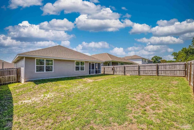 5711 Guinevere Ln, Milton, FL 32583 - back of property with a yard and a fenced backyard