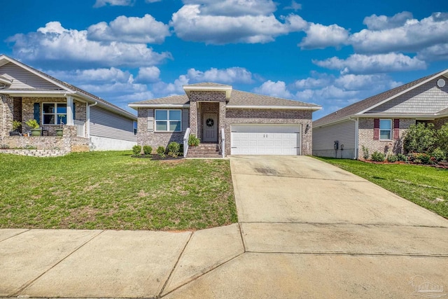 5711 Guinevere Ln, Milton, FL 32583 - view of front of house featuring an attached garage, driveway, a front yard, and brick siding