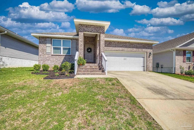 5711 Guinevere Ln, Milton, FL 32583 - view of front facade with a garage, brick siding, a front lawn, and concrete driveway