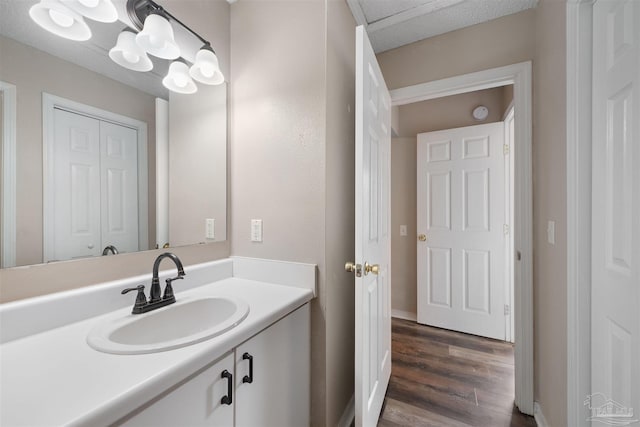 bathroom featuring vanity and hardwood / wood-style floors