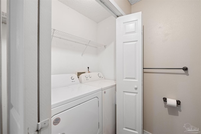 laundry room with separate washer and dryer