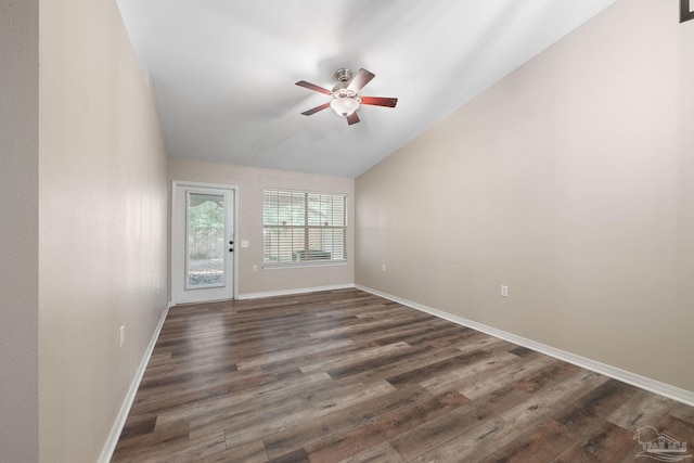 spare room with dark wood-type flooring, ceiling fan, and lofted ceiling