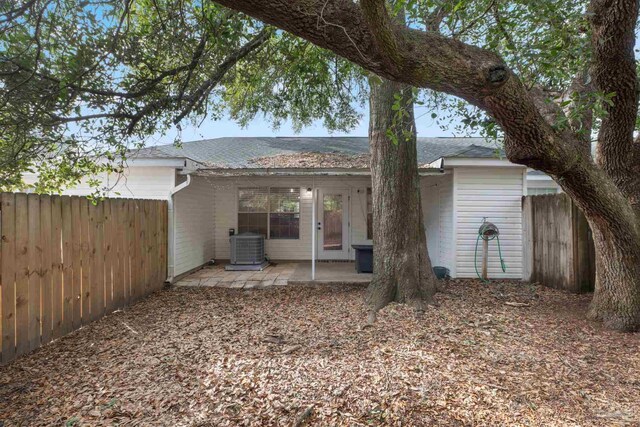 back of house featuring central AC and a patio area