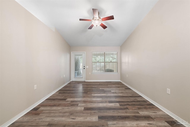 unfurnished room with lofted ceiling, dark wood-type flooring, and ceiling fan