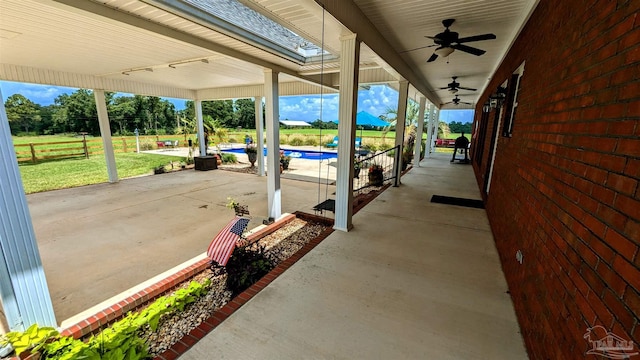 view of patio featuring ceiling fan