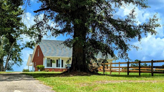 view of front of home with a front lawn