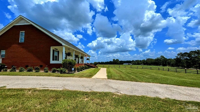 view of side of home featuring a yard